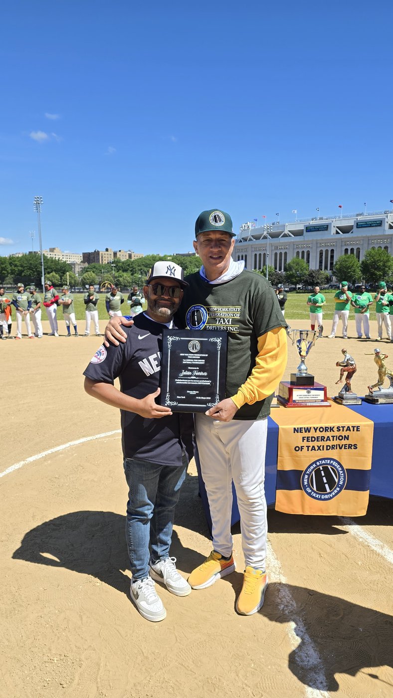 Presenting the plaque honoring Julián Fávarez
