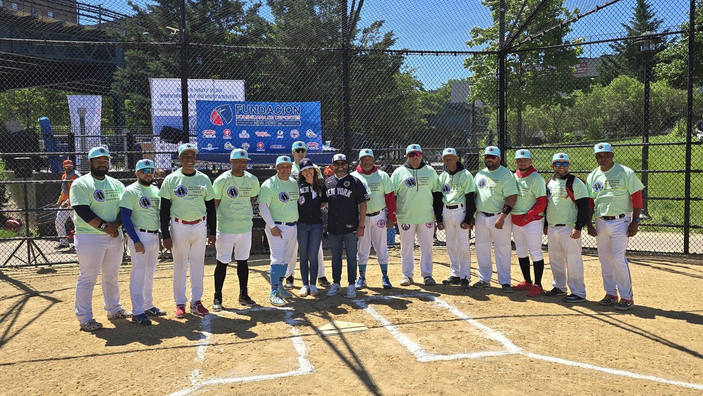 Team photo in front of the Fundación Dominicana de Deportes banner